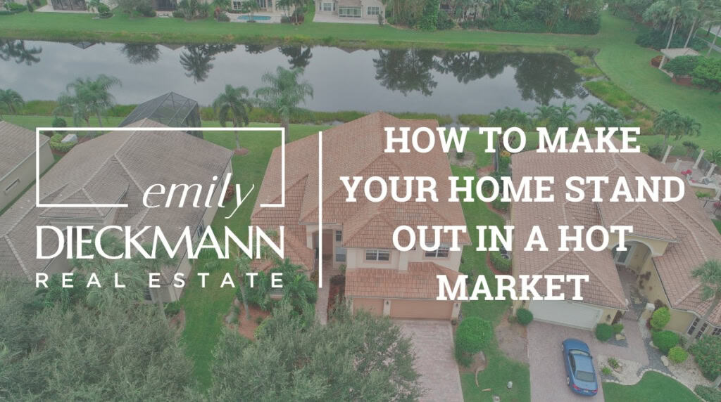 Aerial view of luxurious homes in a gated community with lush greenery and a water body, highlighting Emily Dieckmann’s expertise in luxury real estate and home market trends.